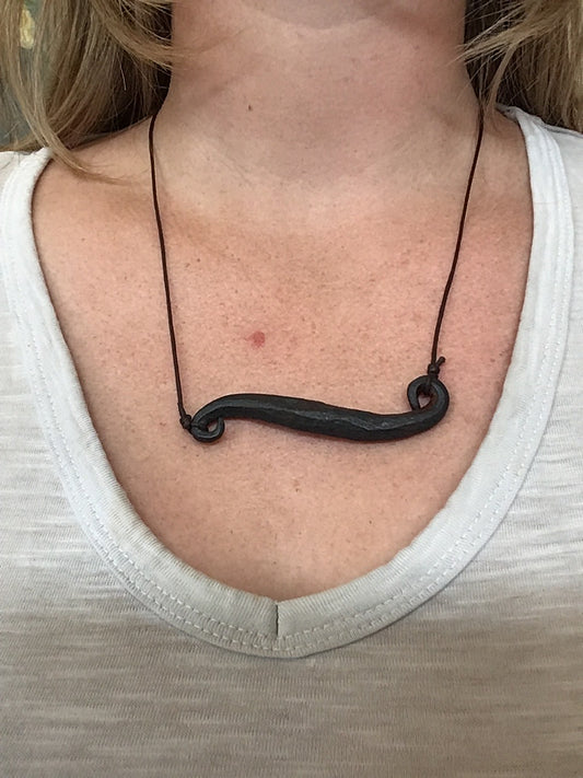 Hand forged curled bar pendant