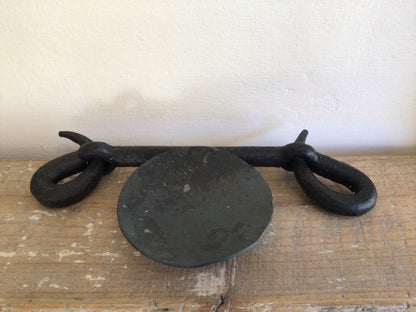 Forged looped candlestick by Piers Edsall